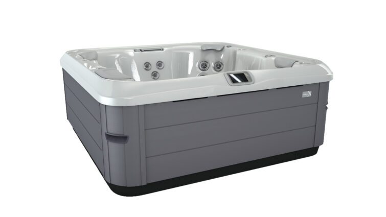 Moderná záhradná vírivka s hydromasážnymi tryskami, sivý obklad a biely interiér – domáci wellness jacuzzi.